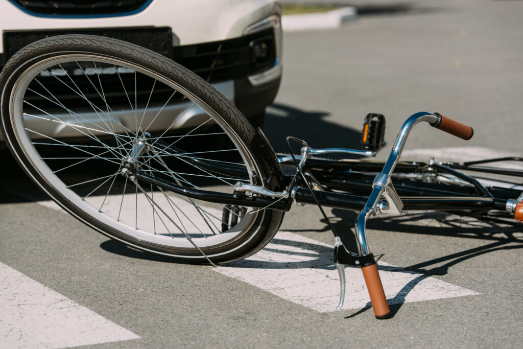 broken bicycle and car crash