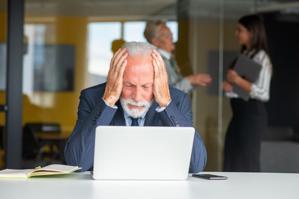 senior businessman working on laptop computer