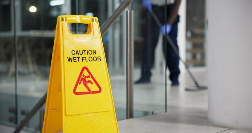 Caution, sign and cleaning for floor, janitor and hygiene service and dark at night in office. Mop,.