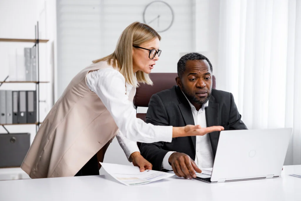 angry female boss scolding african american office