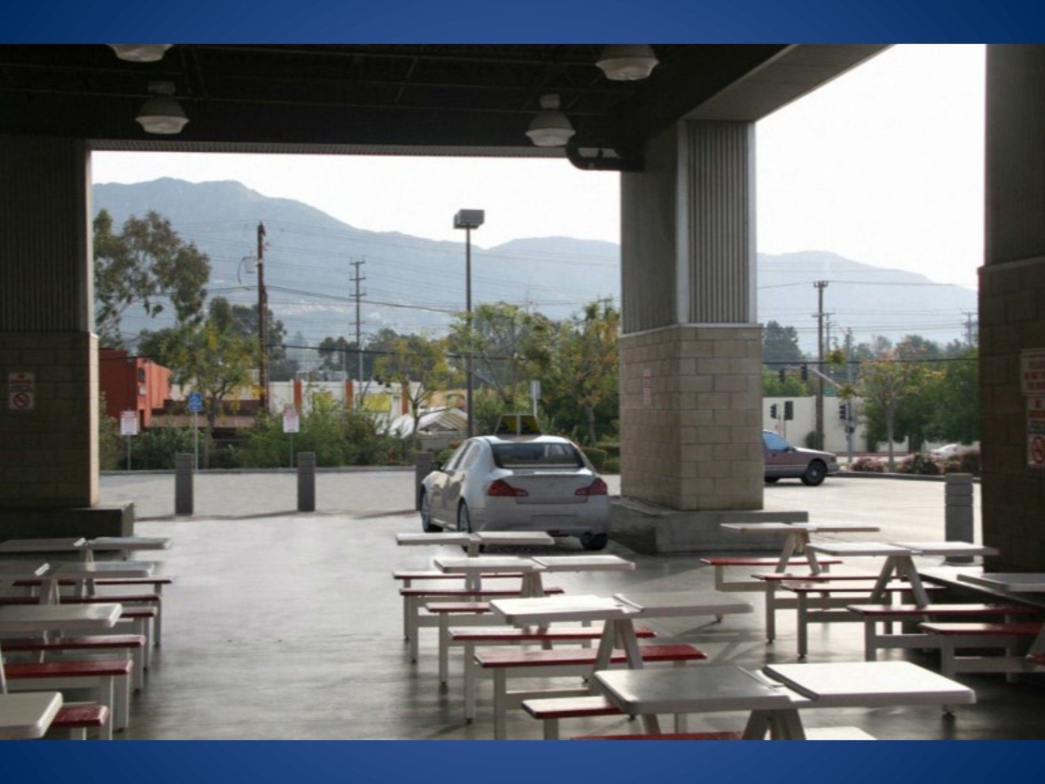 Warehouse store injury case California scene showing the outdoor covered food court seating area where the crash happened
